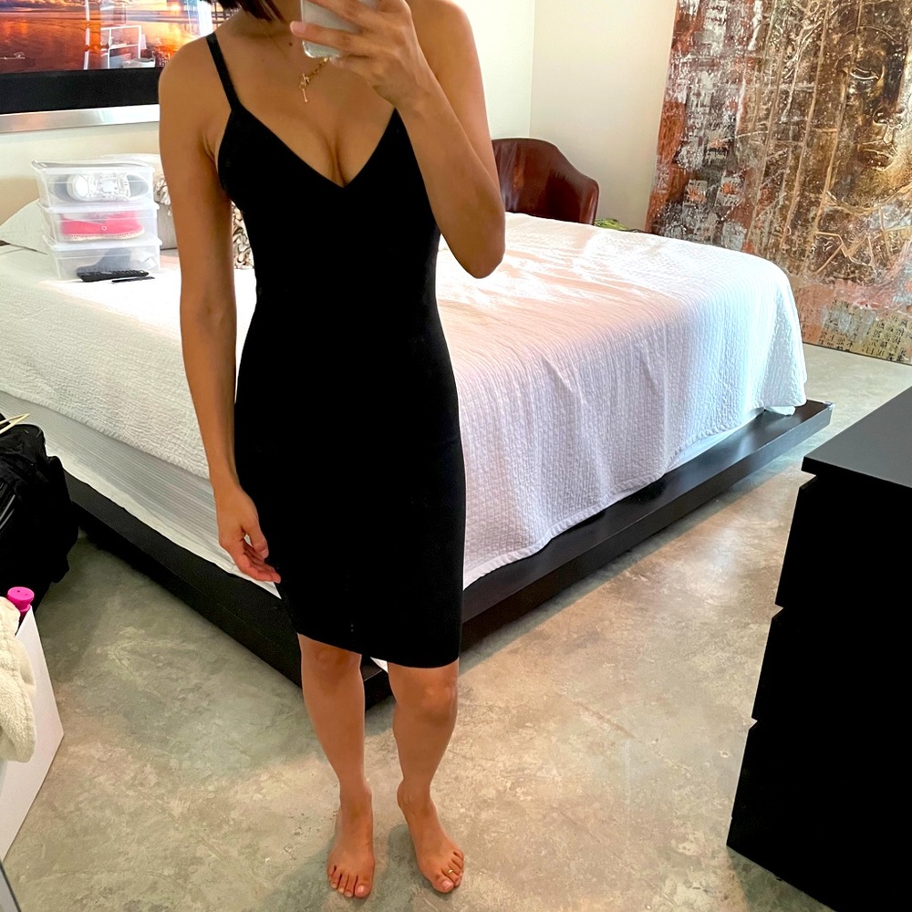 Blaxk form fitting dress. dress up or down